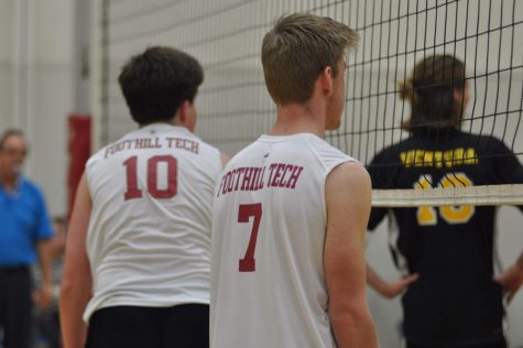 Chance Callaway 21 in position as the opponent Ventura High School sets up and serves the ball over the net.