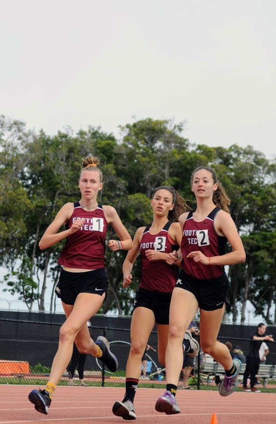 Gretchen Scherrei 20, middle, powers down the track with her teammates. 