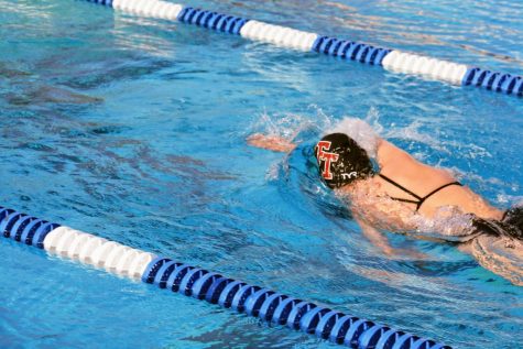 The Foothill girls swim team speeds through the water during their first race in over a year.