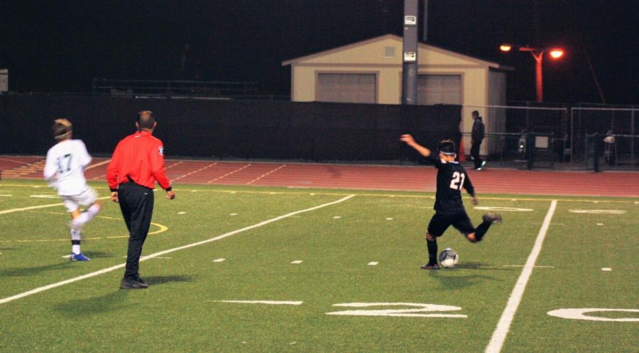 Alex Loza 22 aims for a shot into the goal.