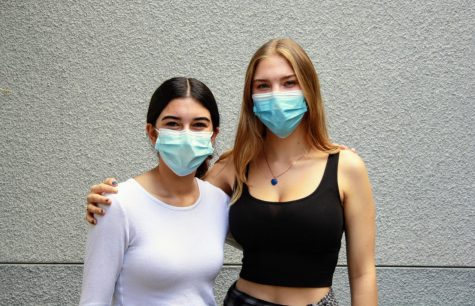Natalie Schermer 24 and Malia Gray 24 smile under their masks while recounting their hard work and dedication this past year.