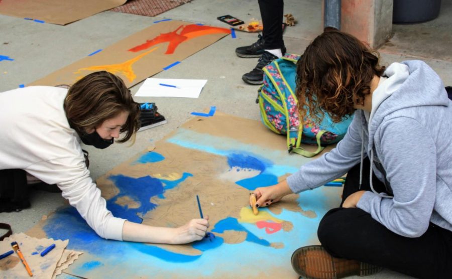 Autumn Campbell '23 and Dylann Overbaugh '23 spend hours carefully detailing faces. 