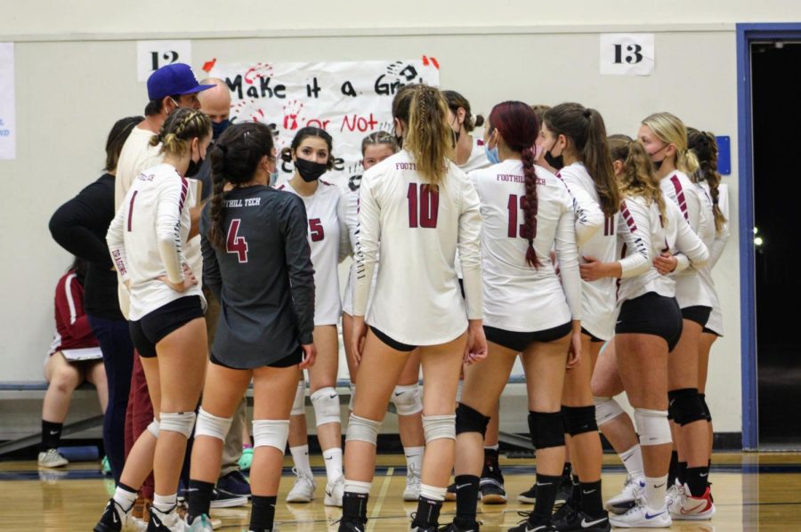  Foothills varsity team huddle together during a time out and plan their next play.