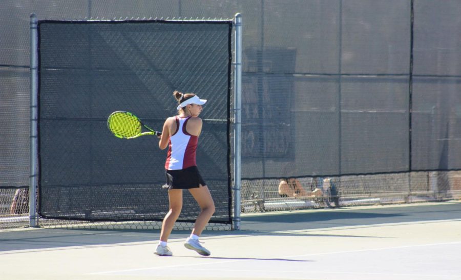Kira Branson 24 keeps her eye on the ball preparing to send it to her opponent.