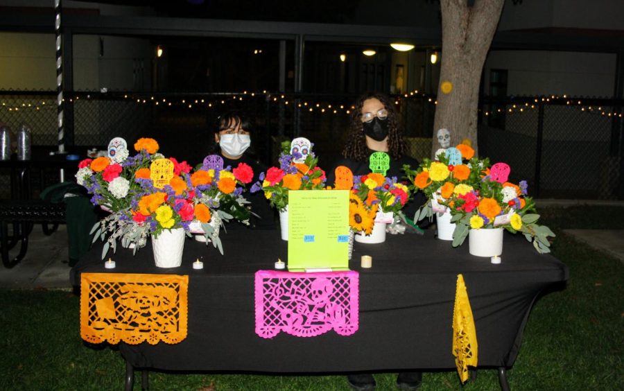 Students present booths where families can purchase flowers, food, and drinks.