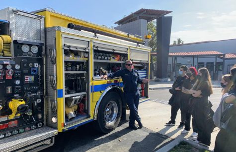 The sun glints off the Ventura County Fire Department truck as BioScience students learn about the various tools firefighters use in an emergency.