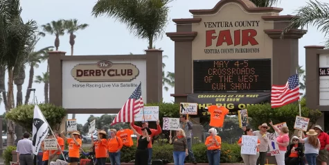 Protesters gather at the entrance of the Ventura County Fairgrounds to voice their desire for the cancellation of gun shows. Photo credit: VC Reporter
