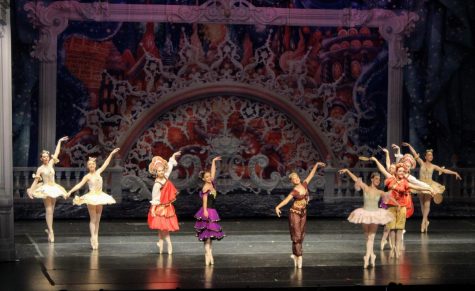 The Ballet Academy Ventura dancers extend their arms, gracefully welcoming the audience into the dreamscape lands of The Nutcracker.
