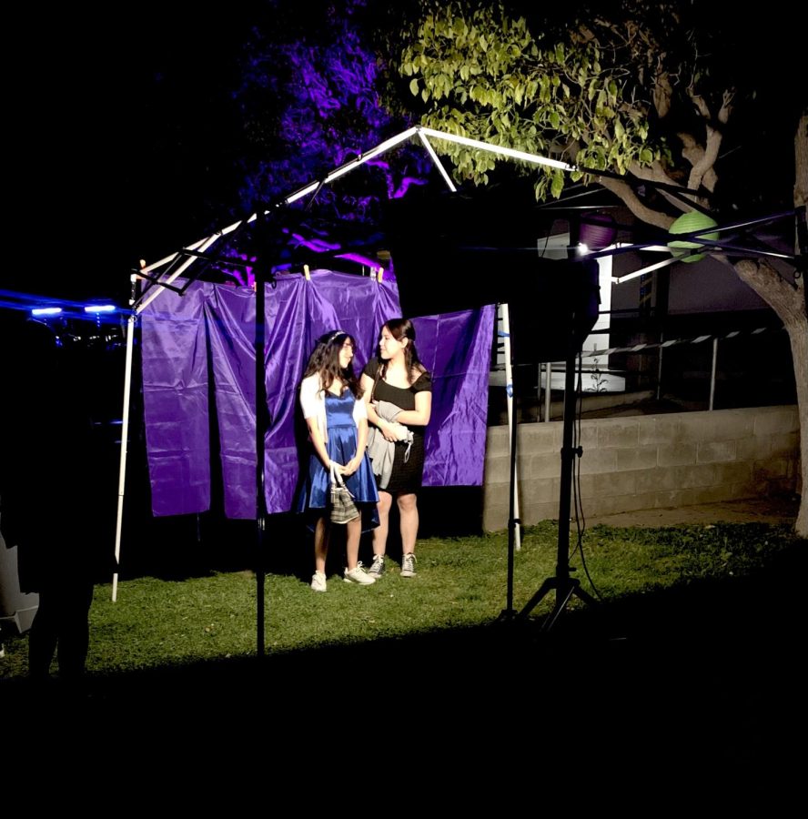 Students captivated in a moment of excitement, pose for the photo booth.