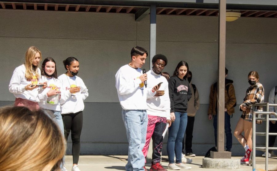 Seniors gather in the quad and listen to their fellow classmate reminisce about the past four years. They recall the challenges they faced, but also the good times they shared as a class. 