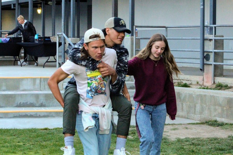 Seniors walk to grab food from snack tables, sometimes even giving piggy back rides to rekindle the spirit of elementary school recess.