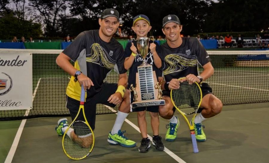 Ben Wang 23 at age 5 with his retired professional tennis coaches Bob and Mike Bryan, who have led him to success since he was young.