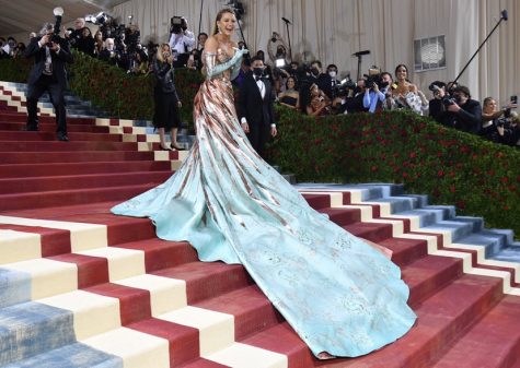 Blake Lively walks the carpet of the Met Gala, impressing onlookers with her dress color change.