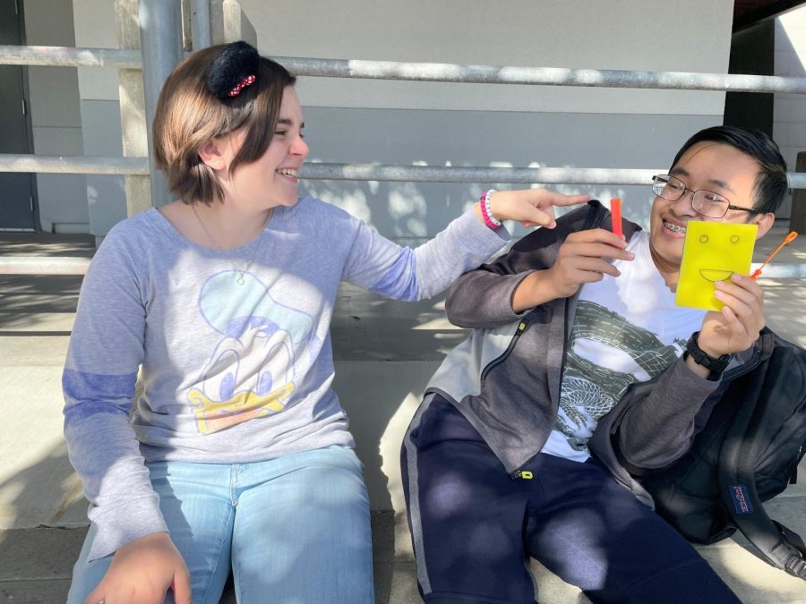 On Nov. 17, 2022, in honor of the SpongeBob vs. Mickey Mouse Club House spirit day, Loral Karian 25 and Quan Nguyen 25 poke fun at each other arguing over which show is better. Karian sports her Disney clothes and Mickey Mouse hair pieces, while Nguyen holds a custom made SpongeBob.