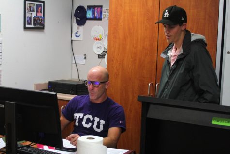 After a long class period, Mr. Fitz, the well-known AP United States History teacher, sits behind his desk and looks intently at his computer to give his student, Jack Pankratz ‘24, a clarification about an assignment.