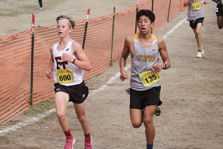 Eli Billings 26 focused and in full stride, racing against competitors at his first ever state championship race to wrap up his season with a five-kilometer personal record of 17:49.3.