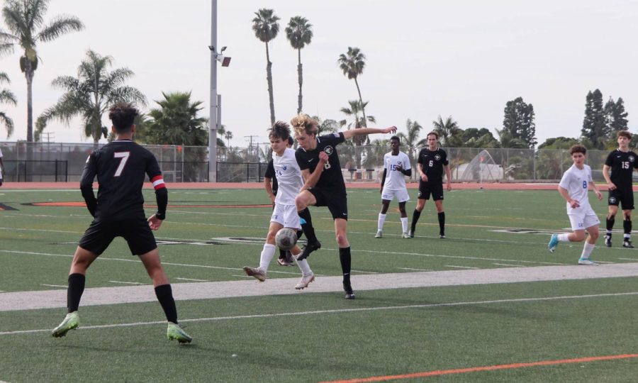 On the bright yet cloudy day of Jan. 7, 2023, Foothill Tech boys’ soccer competes in a fierce game against Cate High School. Connor Bursek ‘25 (number 18) skillfully directs the ball away from opposing players who sprint to keep up, moving the ball up the field and toward the goal.