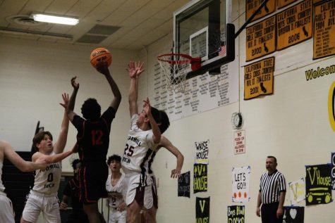 On the night of Feb. 8, 2023, Foothill Technology High School boys basketball faced a devastatingly close loss to Katella High School in their first round of CIF playoffs with a score of 50-53. Jacob Lombardo 23 (number 25) and Sam Noah 23 (number 33) work together in an attempt to block an opponent as he drives in for a floater.