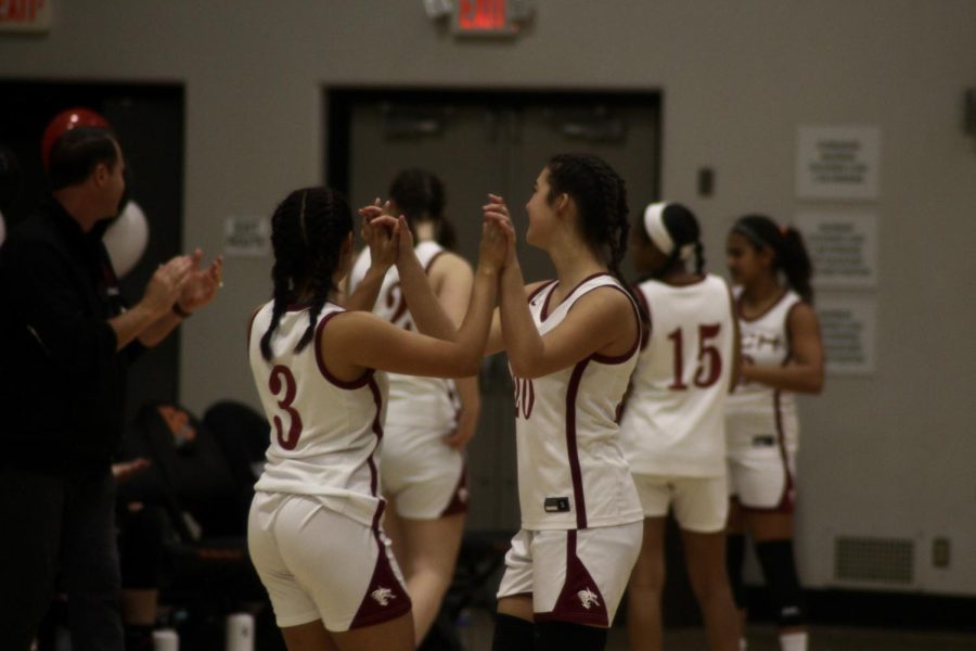 On the night of Jan. 31, 2023, celebrating the Dragon seniors, the girls basketball faced off against Santa Clara High School. In the photo, Esmi Casarez 23 and Olivia Huynh 23 gather in the middle of the court high-fiving each other to get themselves pumped up before the game. 