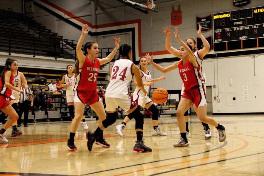 As the third quarter winds down Lauren Kaller 25 (number 24) makes a great bounce pass to her teammate in an attempt to score at the buzzer and to keep their lead.