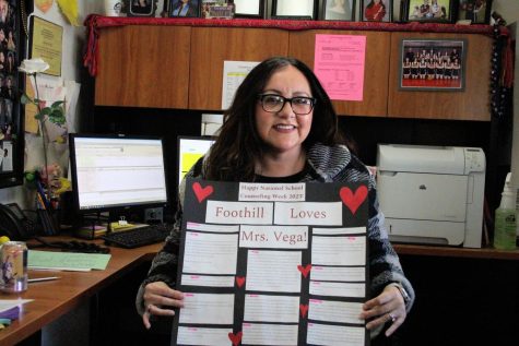 Juana Vega sits in her office, smiling at the camera while holding the sign given to her for National School Counseling Week. Many students, and parents as well, came together and filled out nice notes for the counselors that were then printed out and put on a sign for each of the four counselors, showing the school’s appreciation.