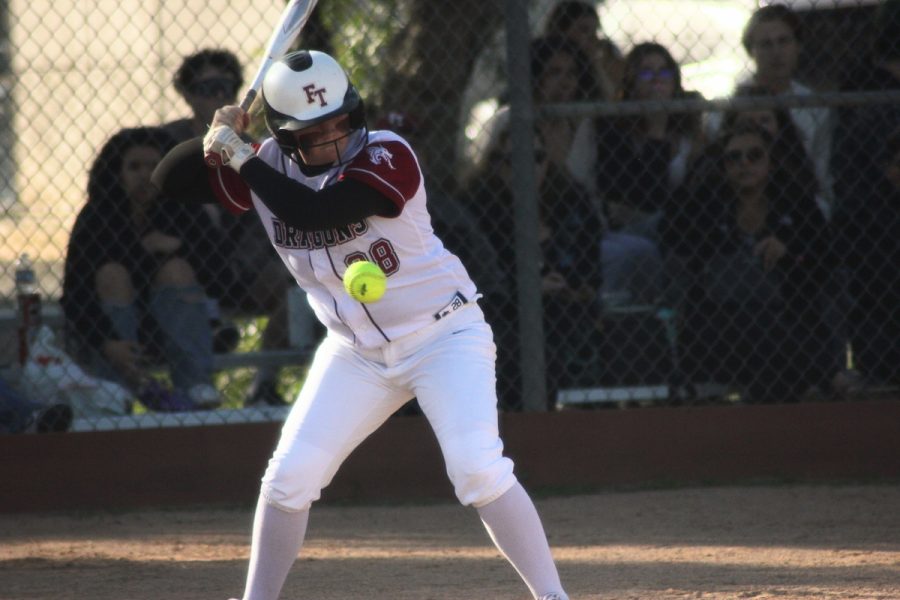 Number+28+for+Foothill+Tech+hits+the+ball+with+a+crack%2C+giving+her+teammates+a+chance+to+run+for+home.