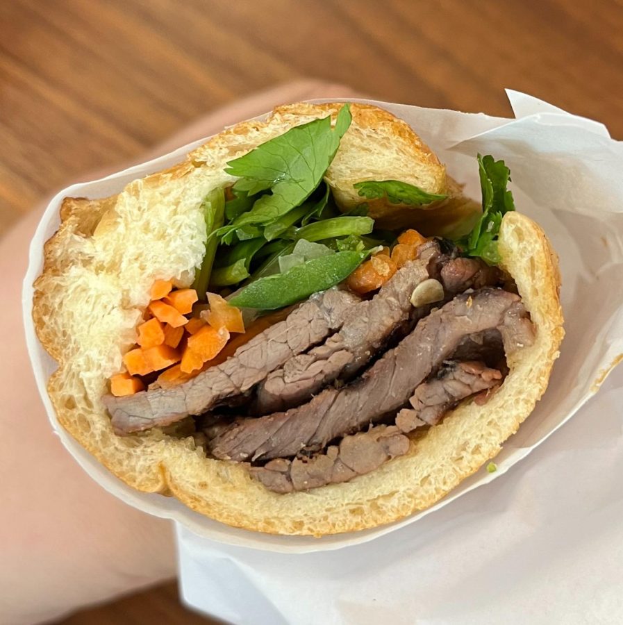 Grilled Beef Banh Mi: this sandwich features a perfect combination of savory beef and refreshing veggies. The banh mi is perfect for a quick meal at The Collection. 