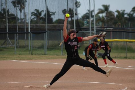 On the eventful evening of April 28, 2023, the girls’ softball team faced off against the Grace Brethren Lancers. Danielle Bishop ‘23 (number 27) winds up as she prepares to pitch the ball in her final high school softball game.