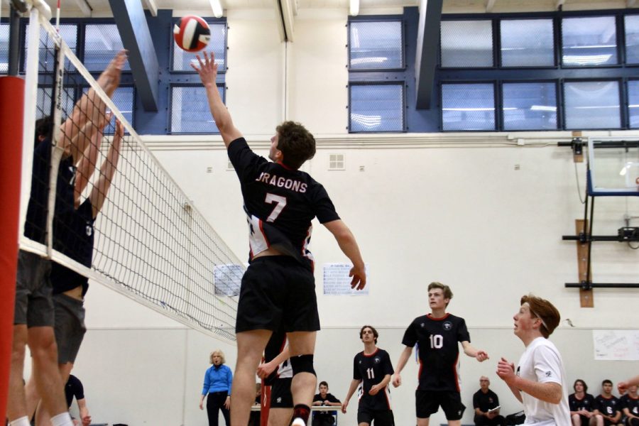 On the night of April 12, 2023, the Dragons honored their senior players while hosting the Laguna Blanca School. Hoping to secure a win on Senior Night and end their league losing streak, the Dragons played hard, but ultimately it wasnt enough to beat the Laguna Blanca Owls. In the photo above, Sean Scampone 23 (number 7) reaches in the air getting ready to tip the ball over the two Laguna Blanca blockers. Behind Scampone, Owen Houston 23 (number 8) is ready to cover in case the Owls send the ball back over.