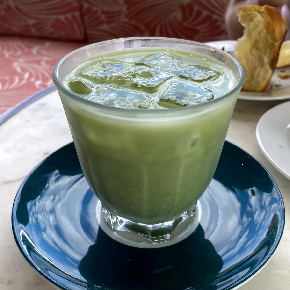 The sweetened iced matcha latte appears with a beautiful green color, making your mouth water before you even take a sip.