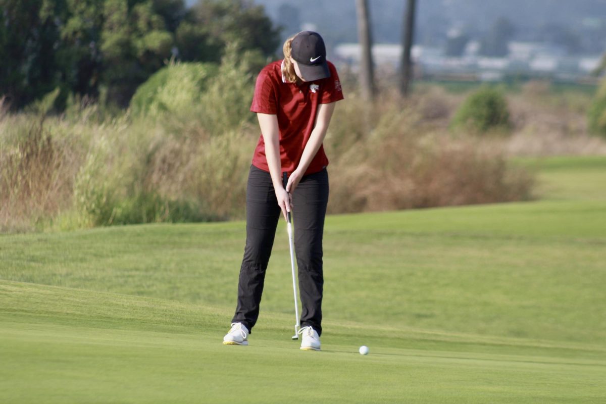 After a few practice putts, Zoe Bellanca 24 lines herself up to get into the best position to putt her ball toward the pin. Hole seven proved particularly hard to Bellanca as she putted four over the par.