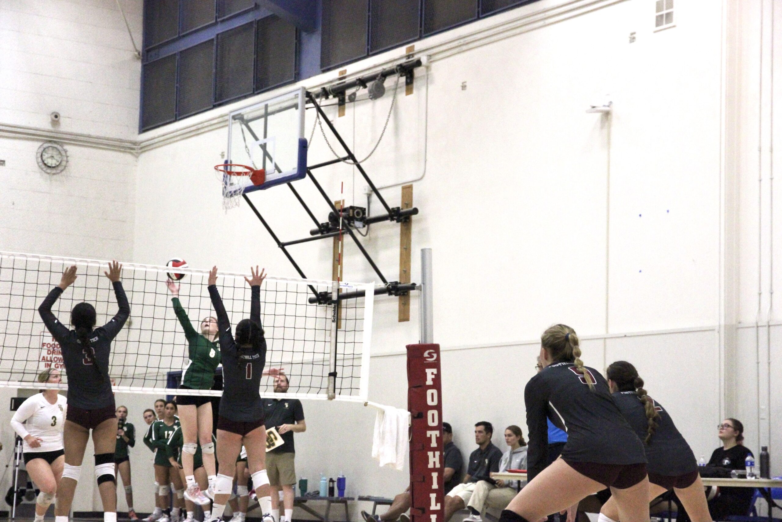 Isabella De La Rosa 24 (number 3) and Charlis Swezy 27 (number 1) block from the net, while Malia Gray 24 (number 9) and Morgan Houston 25 (number 2) stay behind to cover any unexpected plays from the other team.