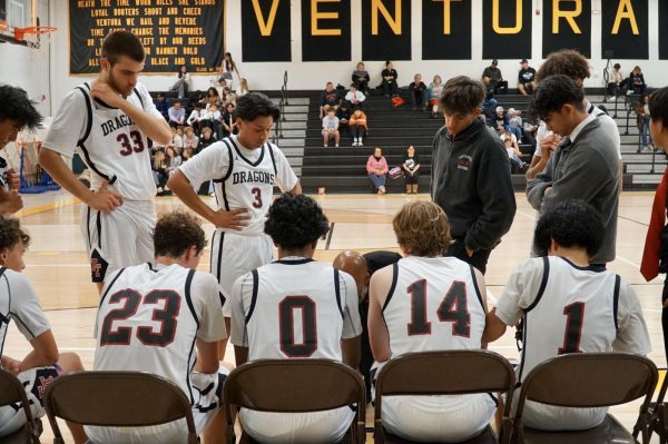 On the night of Nov. 17, 2023, Foothill Technology High School (Foothill Tech) boys varsity basketball endured a tough loss to Buena High School (Buena), 73-30. In the photo, the Dragons meet in a timeout, ready to jump back into the game and turn the tide.