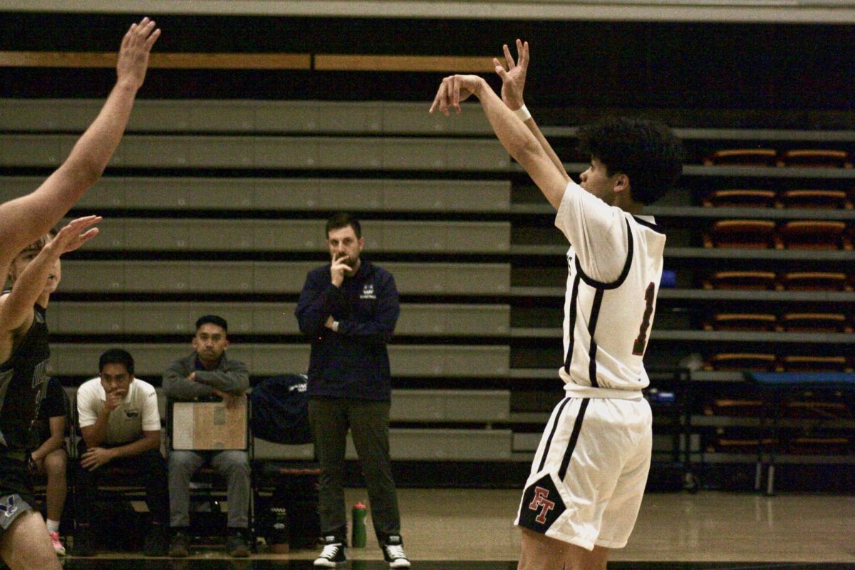 Surrounded by the opposing team, as well as Villanova’s coaches to the side of him, one of the teams point guards, Luigirey Guce ‘25 (number 1), manages to break away and take the shot, scoring a few extra points to finalize the Dragons win.