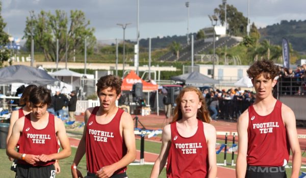 The Foothill Technology High School (Foothill Tech) distance track team walks off the track after an intense 1600 meter race, all going well under the five minute barrier and securing medal positions.