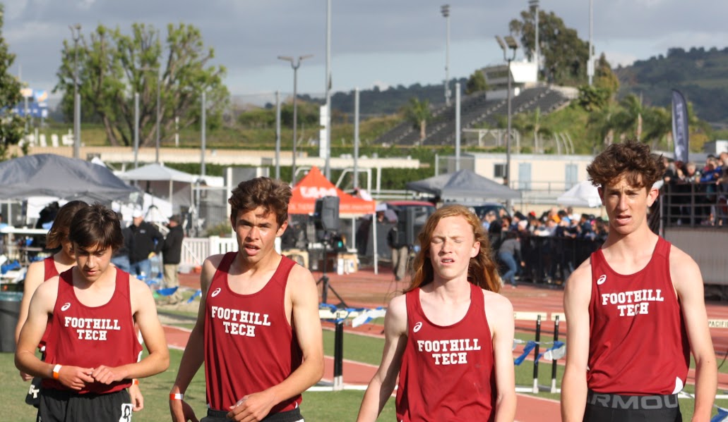 The Foothill Technology High School (Foothill Tech) distance track team walks off the track after an intense 1600 meter race, all going well under the five minute barrier and securing medal positions.