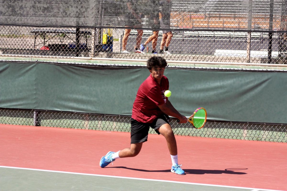Ansh Joshi 26 hits the a backhand in his first match against Mark Keppel.