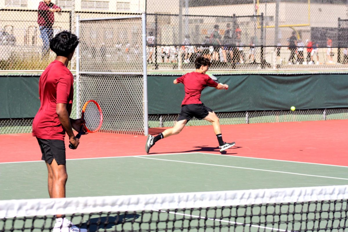 James Sokoloski 24 rushes crosscourt to hit a backhand. Sokoloski and his doubles partner Aaditya Aluri ‘27 claimed victory in all three of their matches.