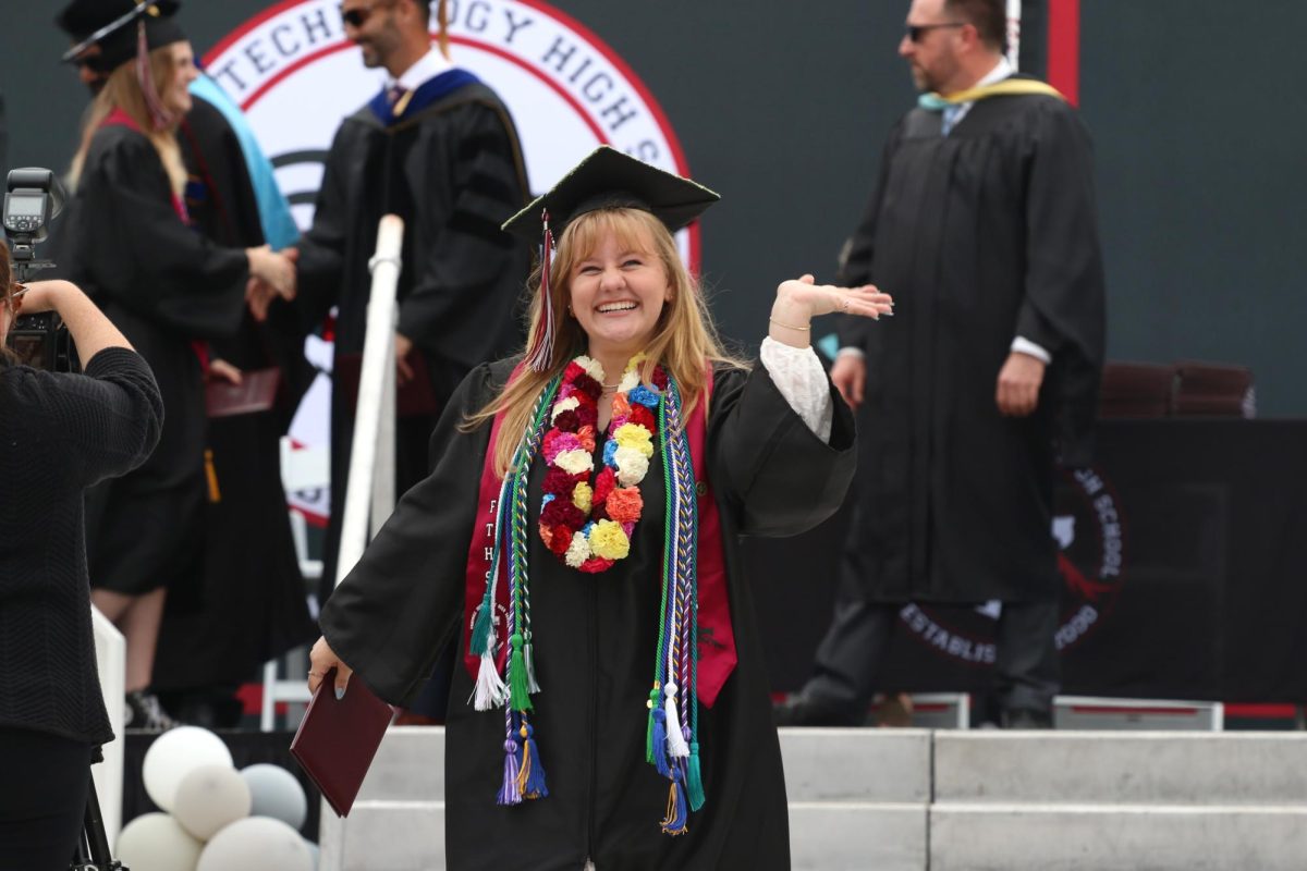 In the afternoon of June 11, 2024, seniors of Foothill Technology High School (Foothill Tech) and their family and friends gathered together on the Ventura College football field to celebrate one of the most momentous occasions for each senior: graduation. Pictured above, Sarah ONeil 24 waves at her family and friends in the audience after making the long anticipated trek across the stage to receive her diploma. Decorated with scads of chords to celebrate her high school achievements, ONeil plans to continue achieving her dreams by attending California State University, Chico in the fall.