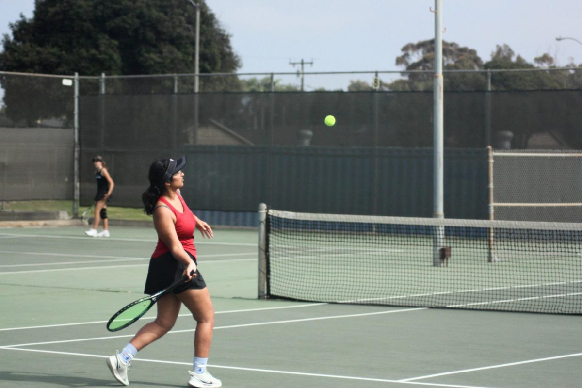 Aditi Shanbhag ‘25 prepares to return the ball, hoping to win the point. She later went on to win all of her sets 6-0, securing three points for the Dragon's tally.