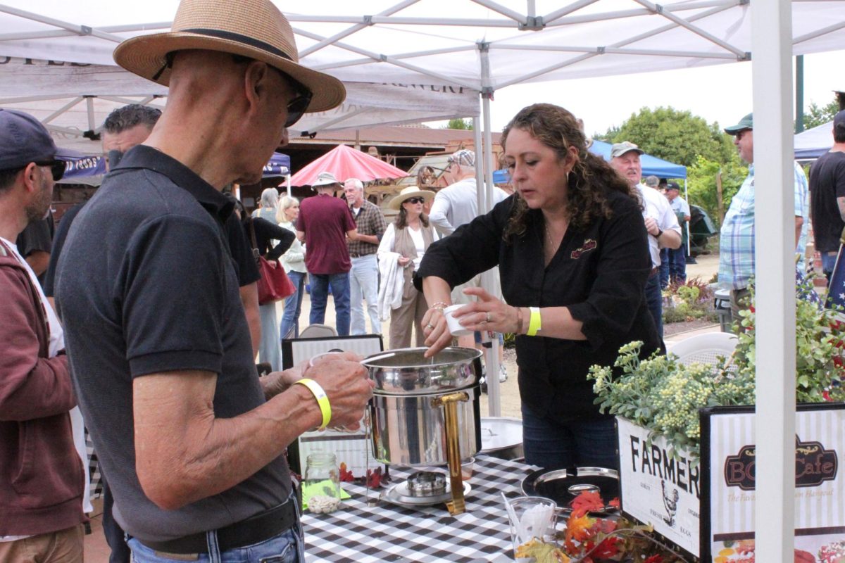 Veronica Muñoz from BG's Cafe, one of the five restaurants featured, served guests ladles of homemade lima bean and ham soup. Each guest was handed three lima beans to place their vote for their favorite restaurant dish.