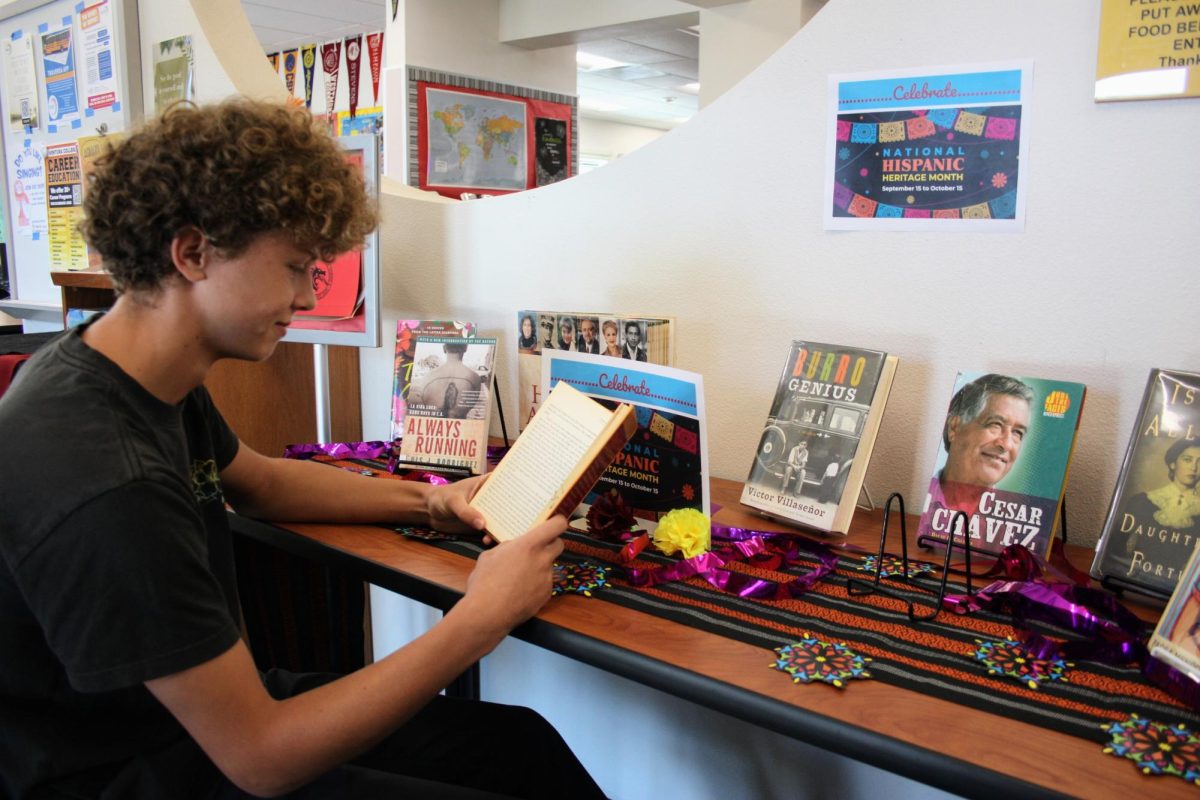 The Foothill Technology High School (Foothill Tech) media center offers lots of options for students to use as a study hall or joint study time with other students during breaks. As we celebrate Hispanic Heritage Month, Sebastian Houvinen '27 reads his favorite book in the media center while surrounded with resources like Cesar Chavez's autobiography and many more.