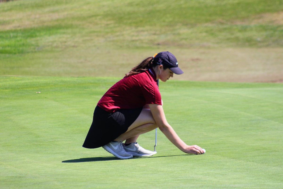 On the blazing day of Sept. 5, 2024 the Foothill Technology High School (Foothill Tech) girls golf team took their skills to Olivas Links Golf Course, against surrounding Ventura high schools. Pictured here is Bella Baum '26 kneeling down to line up her ball to achieve the perfect putt. She finished with a score of 50, having the second lowest score of the team, and contributed to the total of 274 that Foothill Tech scored. The team placed third overall behind Ventura High School (Ventura) and Saint Bonaventure High School (St. Bonnie).