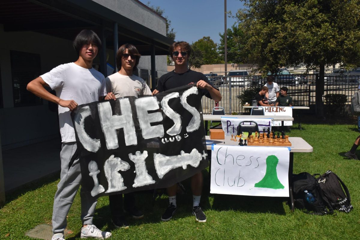 Brandon Chang '26, Donovan Yalinkatian '26 and Gibson MacDougall '26 draw attention to the Chess Club during Club Rush. These students displayed their skills to interested students and attracted a lot of attention to the game of chess.