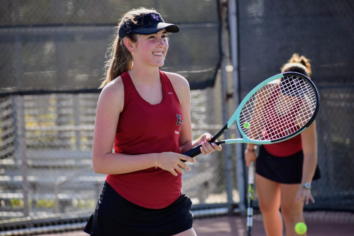 Violet Polley ‘24 shows a warm and excited smile during Foothill Technology High School’s (Foothill Tech) warmup against Cate School (Cate) as the team collectively prepares for an exciting match. Polley’s doubles partner Ryan Alderman ‘25 had a tough battle against the Dragon's opposing line up.