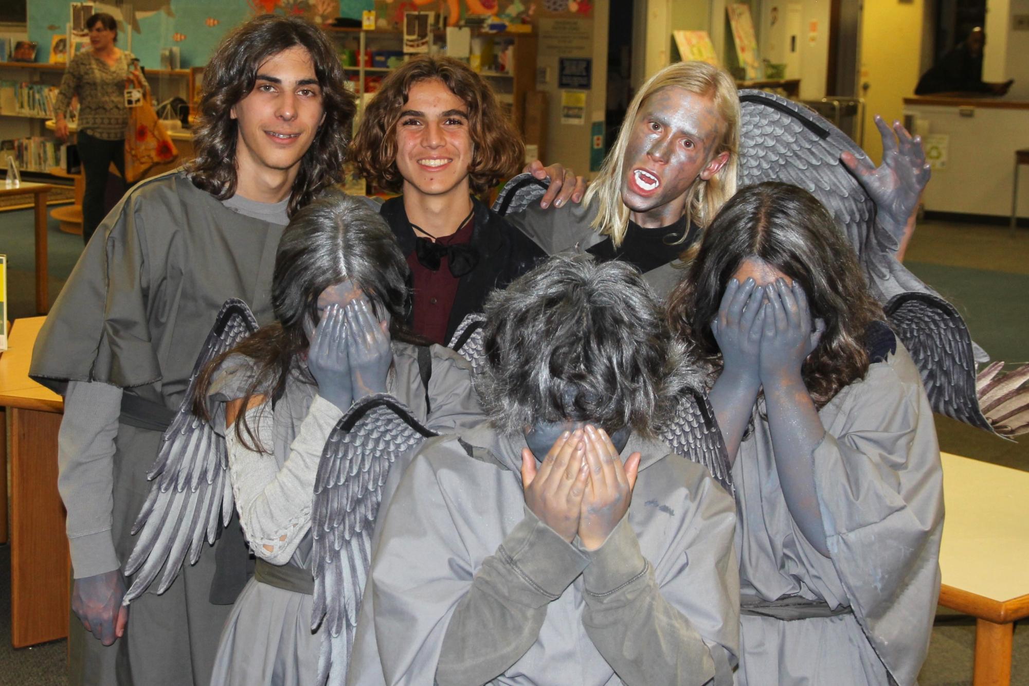 Covered in silver body paint, the weeping angels group is dressed in gowns with wings on their back. Following right behind you through the stacks, they move with precision to catch you off guard when least expected.