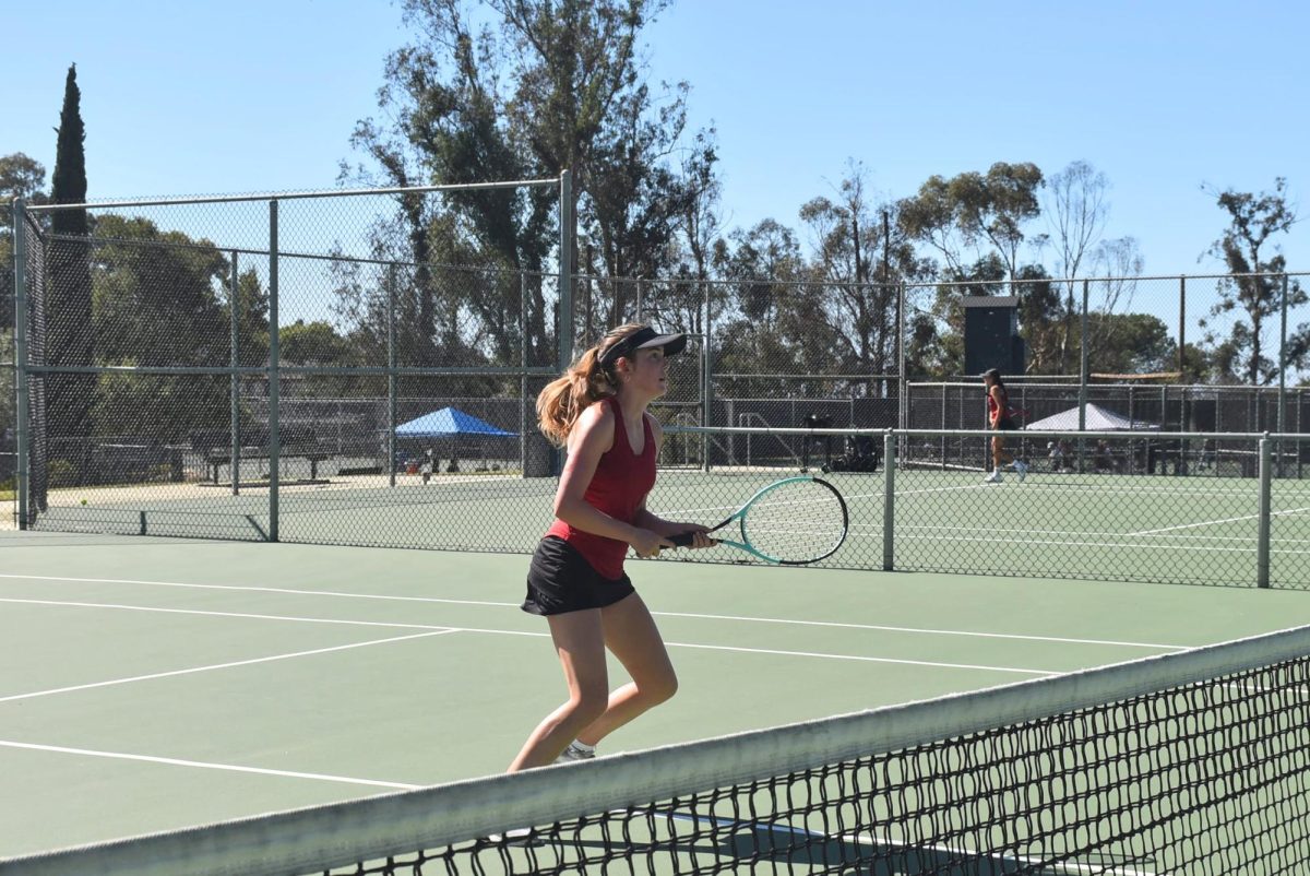 Violet Polley '26 approached the net, focused on the ball approaching her. She successfully volleyed the ball and placed it right at the feet of her opponent at the net, winning the point. Polley, playing line two doubles during the tennis season, used her strengths from playing singles prior, consistently placing groundstrokes out of reach. 