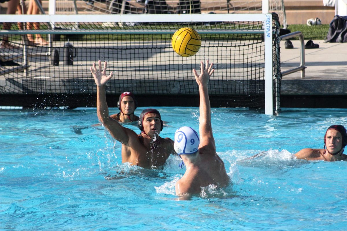 On the early afternoon of Oct. 1, 2024 the Foothill Technology High School (Foothill Tech) boys water polo team held their match against Cate School (Cate) at the Ventura Aquatic Center located inside Kimball Park. It was a tough game fought by both teams but in the end Cate took the win 10-13. Pictured here is  Aiden Cumming ‘25 (number 2) reaching up to block the ball from making it to the goal, helping out the team's goalie.