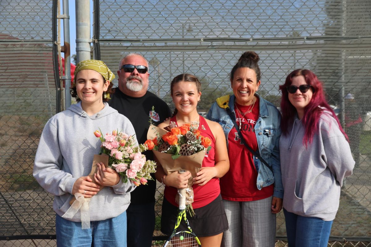 Ryan Alderman '25 poses with her parents on her senior night. Her family celebrates with her, giving her flowers and praise for her senior season and her overall high school tennis career. As a senior, the Foothill Technology High School (Foothill Tech) community is honored to have her represent their program.