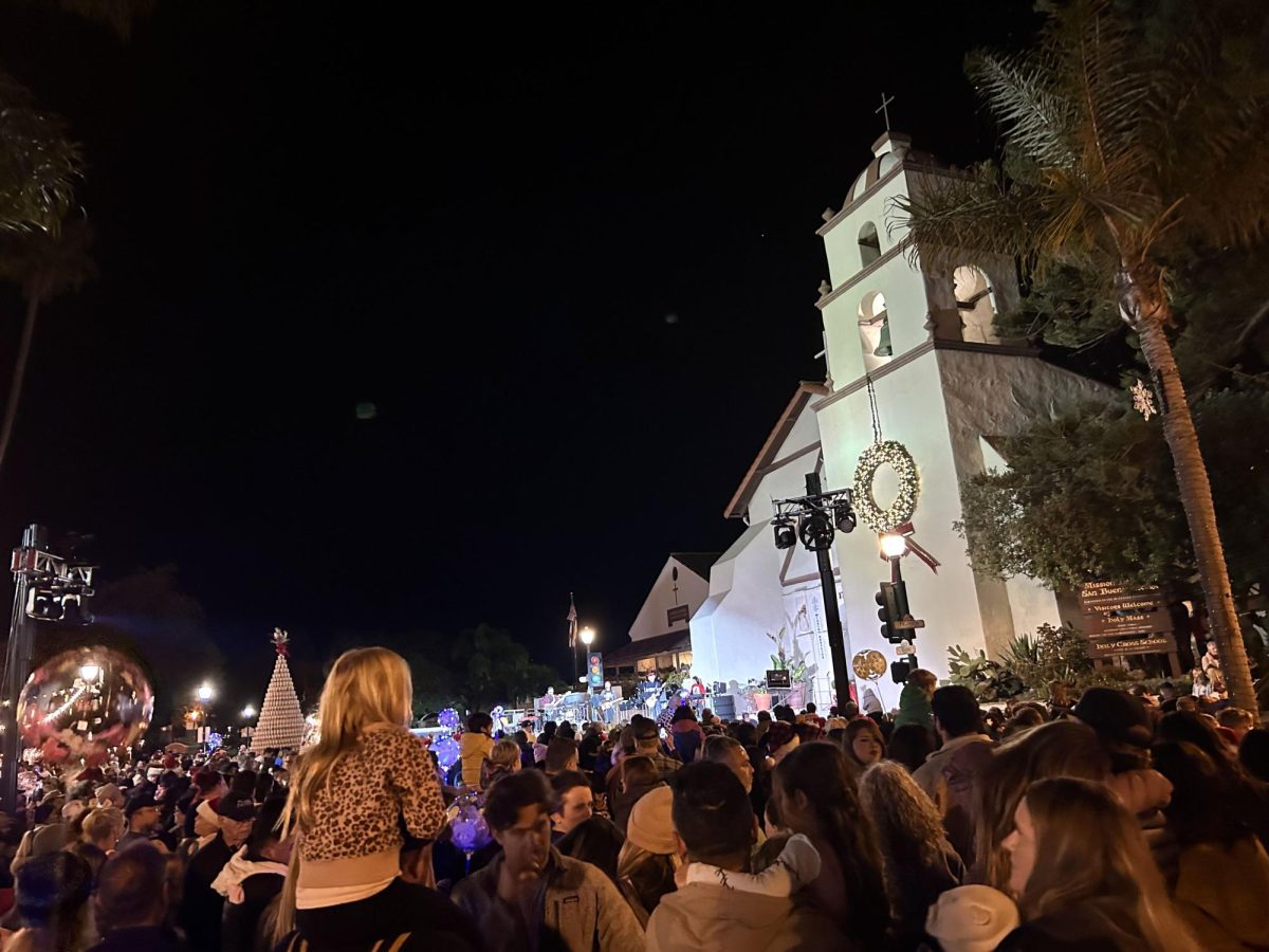 The San Buenaventura Mission, a staple of the Ventura community, serves as the stage for music performances and pictures. As crowds gather, the countdown starts. The tall Norfolk Christmas trees lit up the sky as the streets of downtown Ventura filled with holiday cheer on the night of Friday, Dec. 6. Guests enjoyed warm food and drinks on this eventful evening.